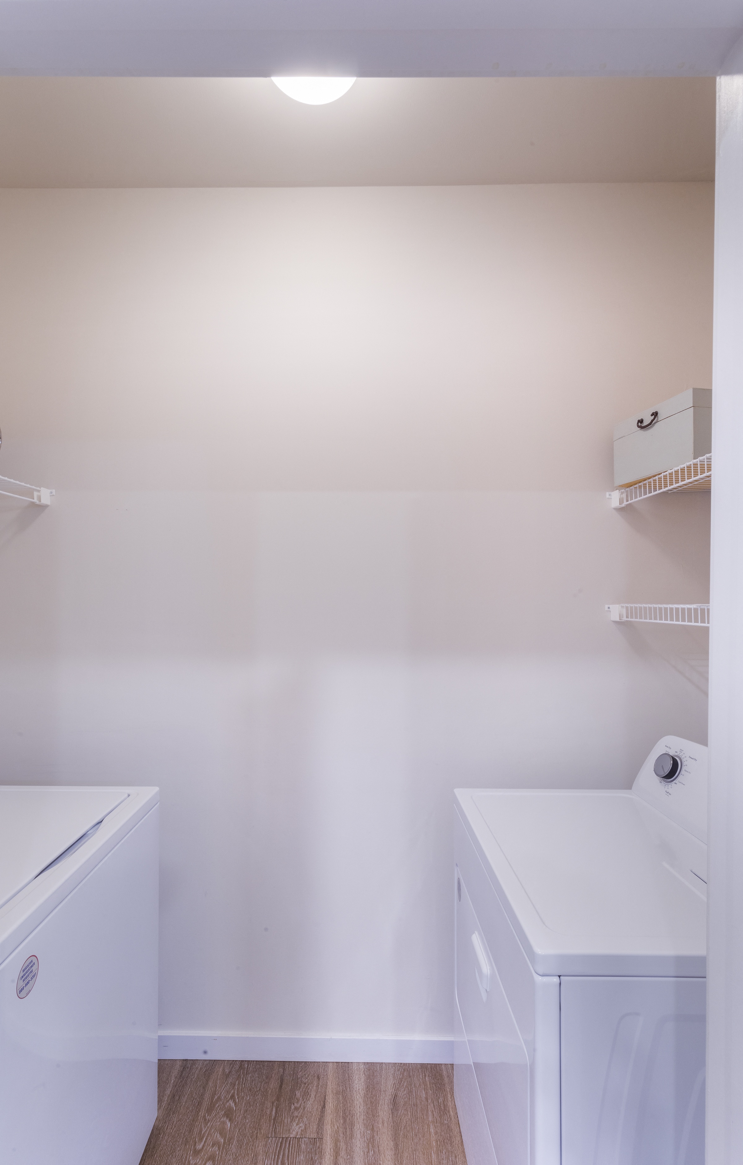 a washer and dryer in a room with white walls at Aventura at Towne Centre, Ellisville, MO, 63011